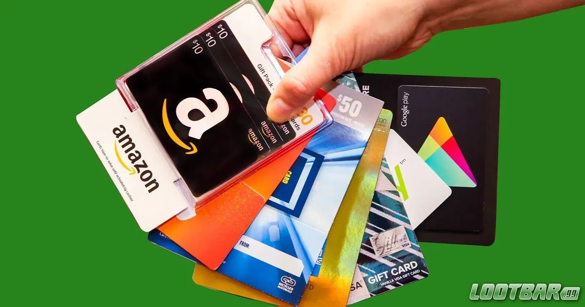 A hand holding variety of gift cards